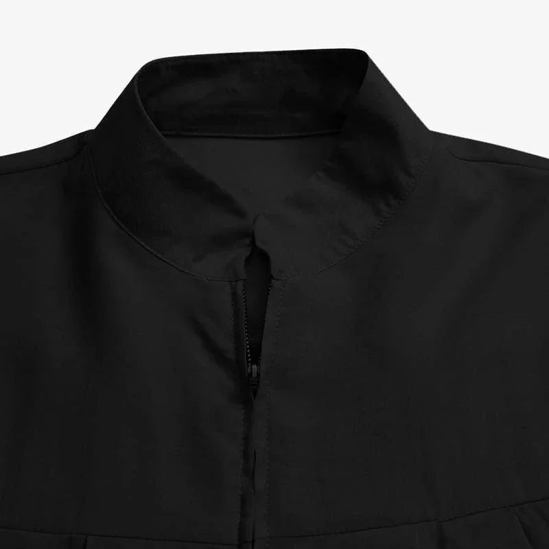 Muslimisches schwarzes Kleid mit kleinem Stehkragen und Reißverschlusstasche im eleganten, lockeren und lässigen Langarmrock